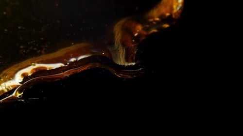 Extreme closeup of liquid and ripples on surface, blowing air, abstract shot