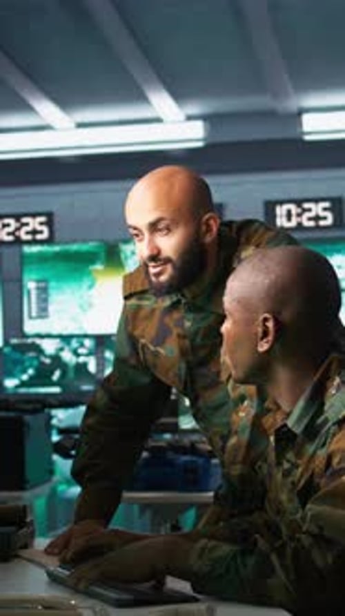 Men in Uniform Work at a Computer