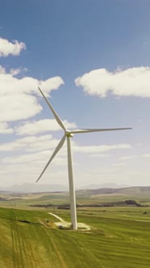 Green, wind turbine and renewable energy in environment, drone or sustainability with zero