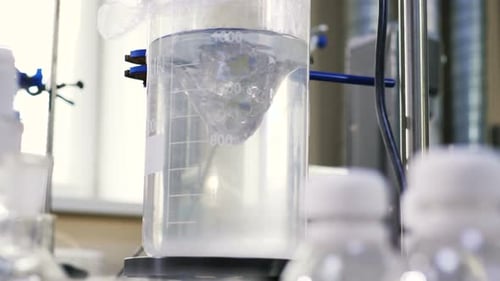 Clear Liquid Mixed in Beaker By Test Appliance in Lab