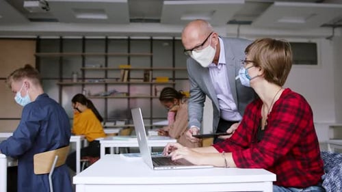 Young Students with Teacher at Desks at College or University, Coronavirus Concept