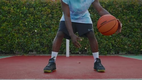 Skilled Basketballer is Dribbling Ball on Street Basketball Court Fulllength Portrait of Black Guy