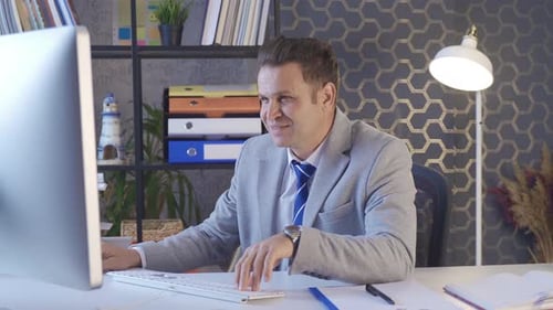 Office worker rejoicing and clapping.