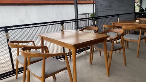 The footage shows the tables and chairs of customers of the concept coffee shop inside an aesthetic