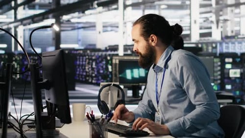 Panicked Engineers in Data Center Reacting to Ransomware Warning on PC