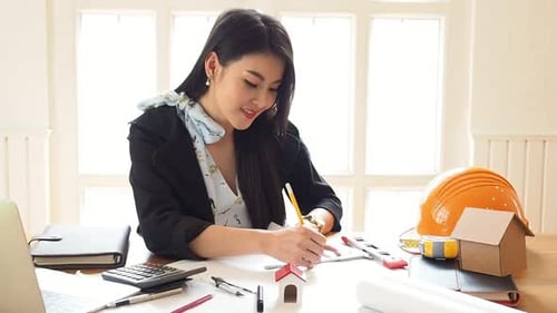 An architect or engineer working on blueprint, architectural concept.