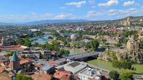 Aerial View of City Buildings, Architecture, and River