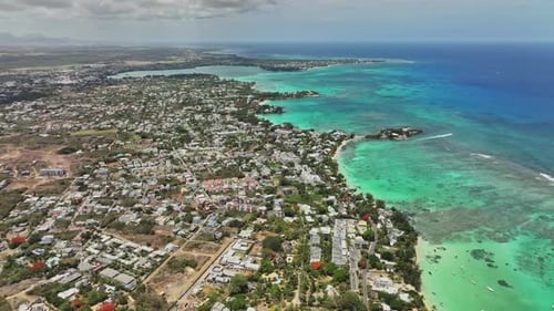 An aerial view of a city and the ocean