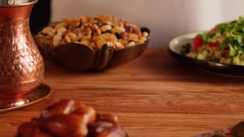 Table Set with Dates, Hummus, Nuts, and Appetizers