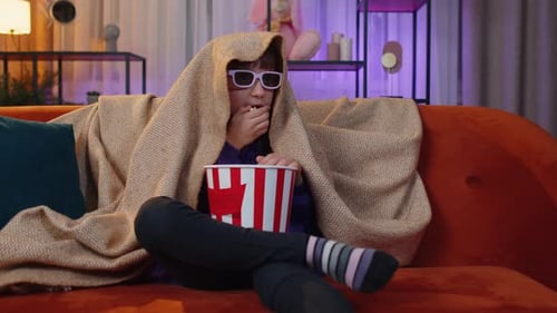 Girl Watches Movie with 3D Glasses and Popcorn