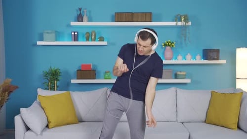 Energetic Man Dancing in His Living Room
