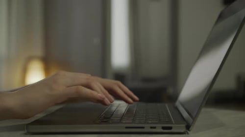 Hands Typing on Laptop Computer IT Employee Working Close Up