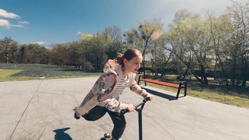 Cute Little Girl Rides By Scooter