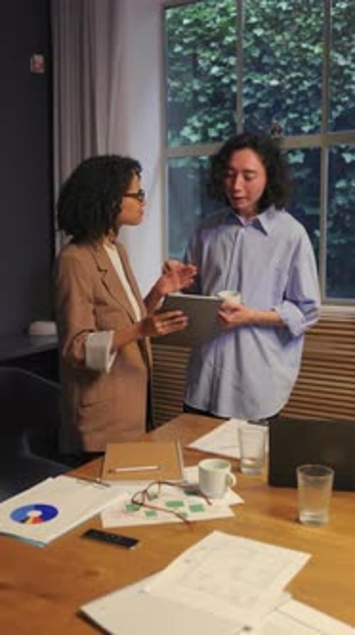 Diverse Business People Discussing Project Ideas Together in a Modern Bright Office