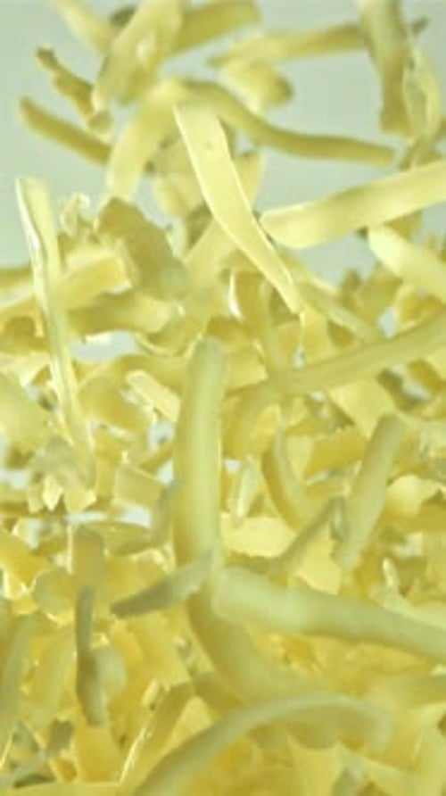 The Grated Cheese Flies Up and Down Filmed on a Highspeed Camera at 1000 Fps