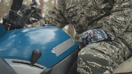 Mechanicstyle Inspection of ATV Before Extreme Trail Ride Detailed View of Rider Examining Throttle