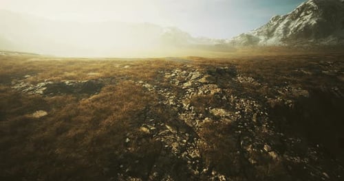 Majestic Mountain Landscape Under Soft Sunlight with Rocky Terrain