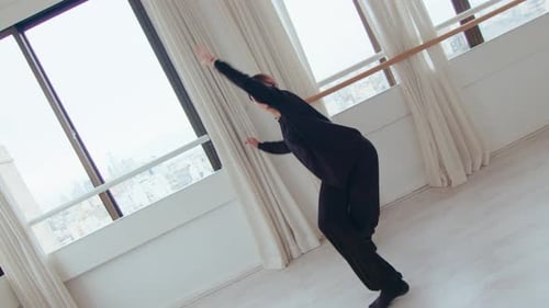 Woman Dancing in a Bright Urban Dance Studio