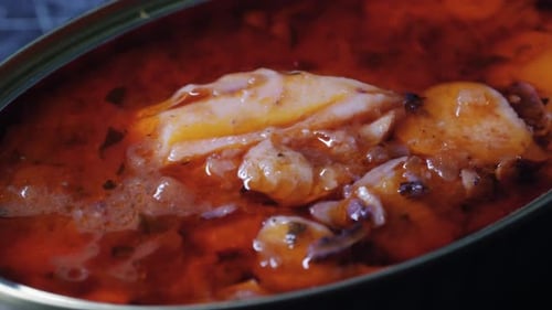 Opening Canned Octopus Squid Fish Can Man Open the Canned Seafood on the Table Close Up on