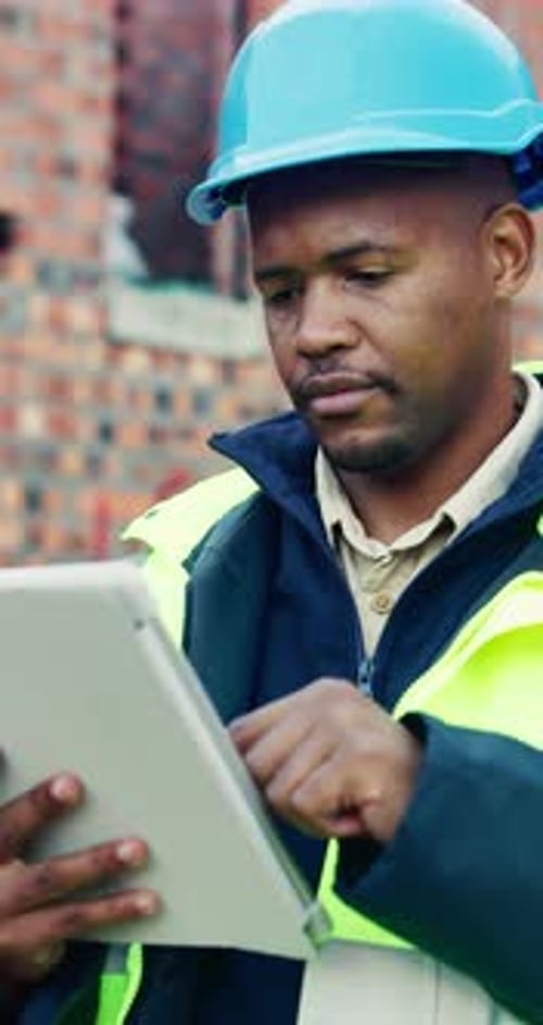 Tablet, black man and scroll on construction site with planning for building, renovation or repairs
