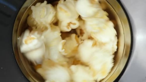 Close Up Top View on Home Popcorn Maker Making Fresh Crispy Popcorn Popcorn Popper or Machine for