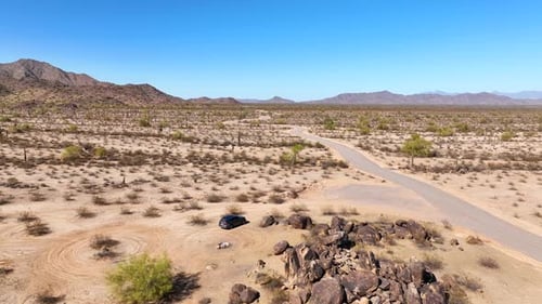 Aerial view of desert landscape with road, United States.