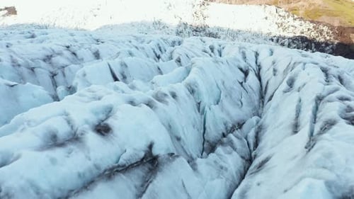Jagged cracked surface of Virkisjökull glacier in Iceland, aerial