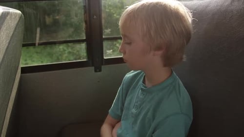 kids riding the school bus to class - Thinking kid on school bus