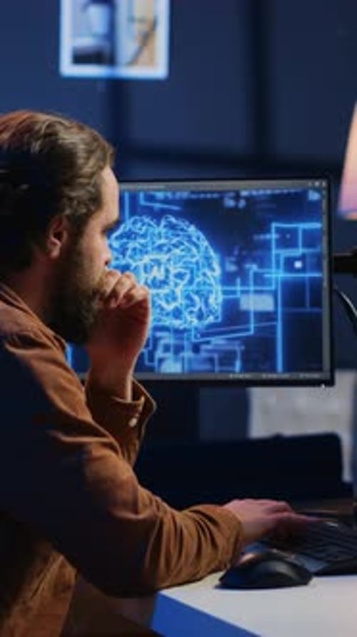 Teleworking IT Employee Runs AI Script on Computer From Home Office