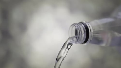 Water Flows From the Bottle in Slow Motion