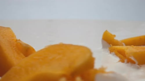 Closeup Fresh Apricot Yogurt with Pieces Juicy Tasty Fruit Background. Bright Yellow