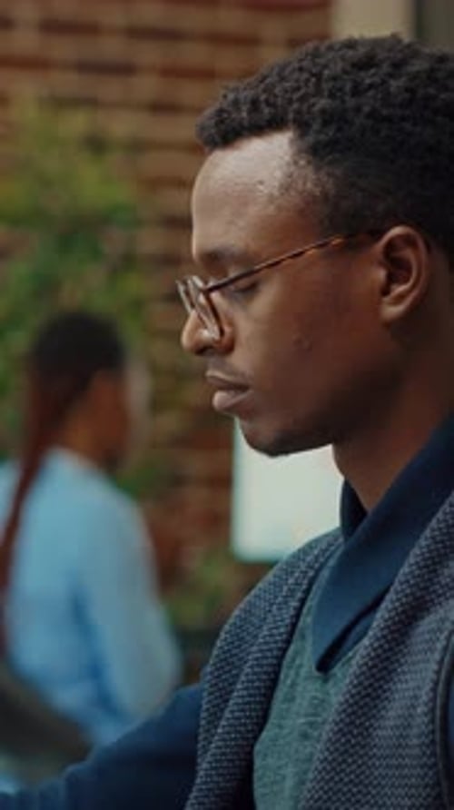 Vertical Video Startup Worker Using Laptop in Office