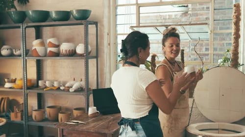 Pottery, store and people check cup, ceramic clay design or mold for quality assurance