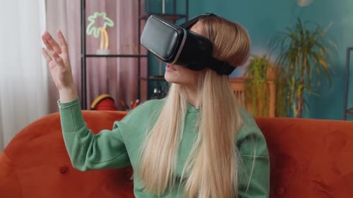 Woman Experiencing Virtual Reality Headset on Couch
