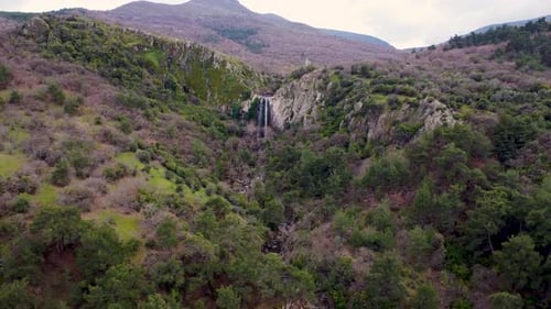 Aerial waterfalls among green trees 4K