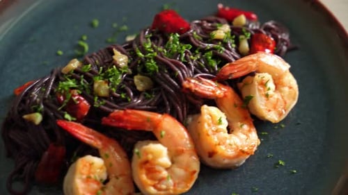 Delicious Black Pasta and Shrimp Food Close Up