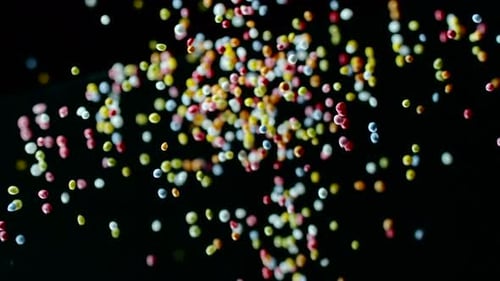 Sprinkles tumble onto surface at 2000fps