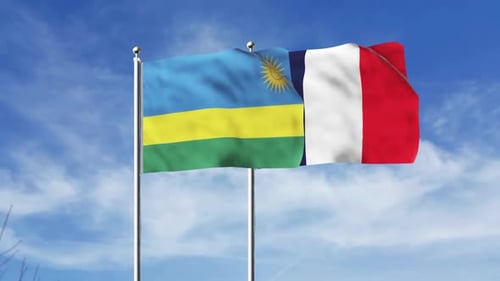 Rwanda and France National Flags Waving on Flagpoles