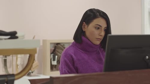 Fashion Designer Working in Boutique