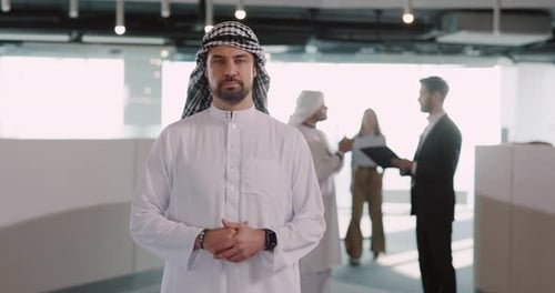 Man in traditional dress in an office