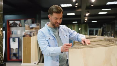 Architect Choosing Floor Tiles in a Showroom