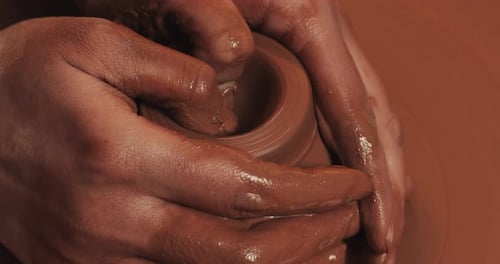 Potter Makes Pottery From Clay Close Up Making Ceramic Products From Red Clay Twisted Potter's Wheel