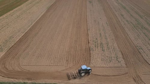 Agricultural Work with Tractor Preparing Field for Harvesting