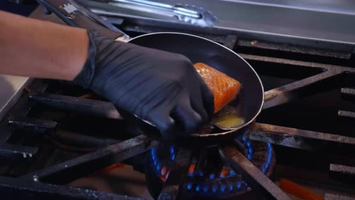 Salmon Fillets Cooking in Oil on Stove