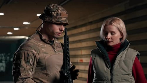 Man with Rifle Next to a Woman