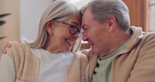 Senior Couple Shares Loving Moment at Home