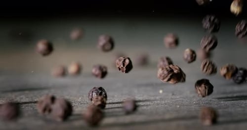 Peppercorns or black pepper spice. Super Macro Close Up. Shot on super slow motion camera 1000 fps.