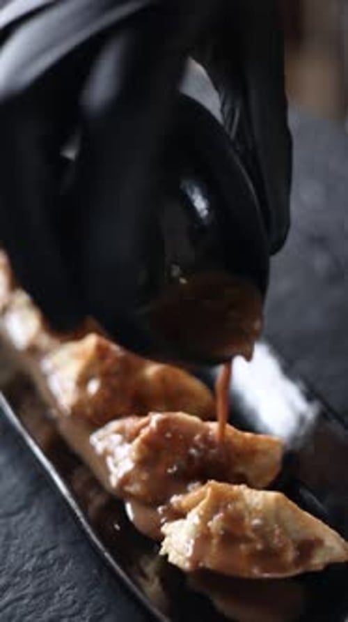 The chef prepares gyoza. Close-up