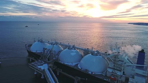 Aerial of Liquified Natural Gas LNG Carrier Moored to a Small Gas Terminal Fuel Crisis Sanctions