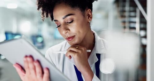Woman Uses Tablet in Science Laboratory